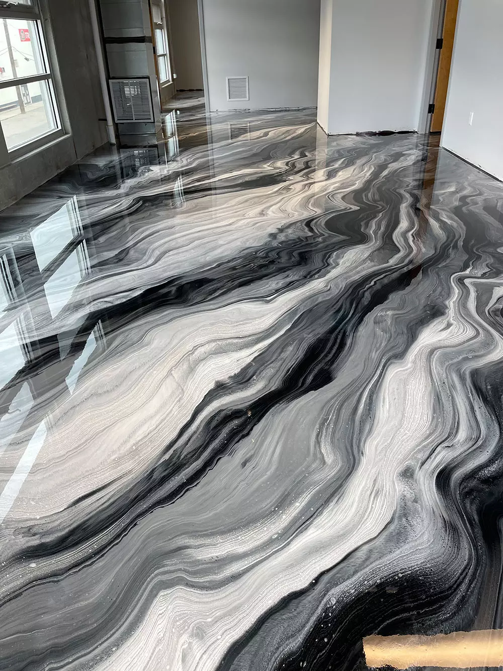 photo of a beautifully designed concrete surface with dye and polish for the perfect finish