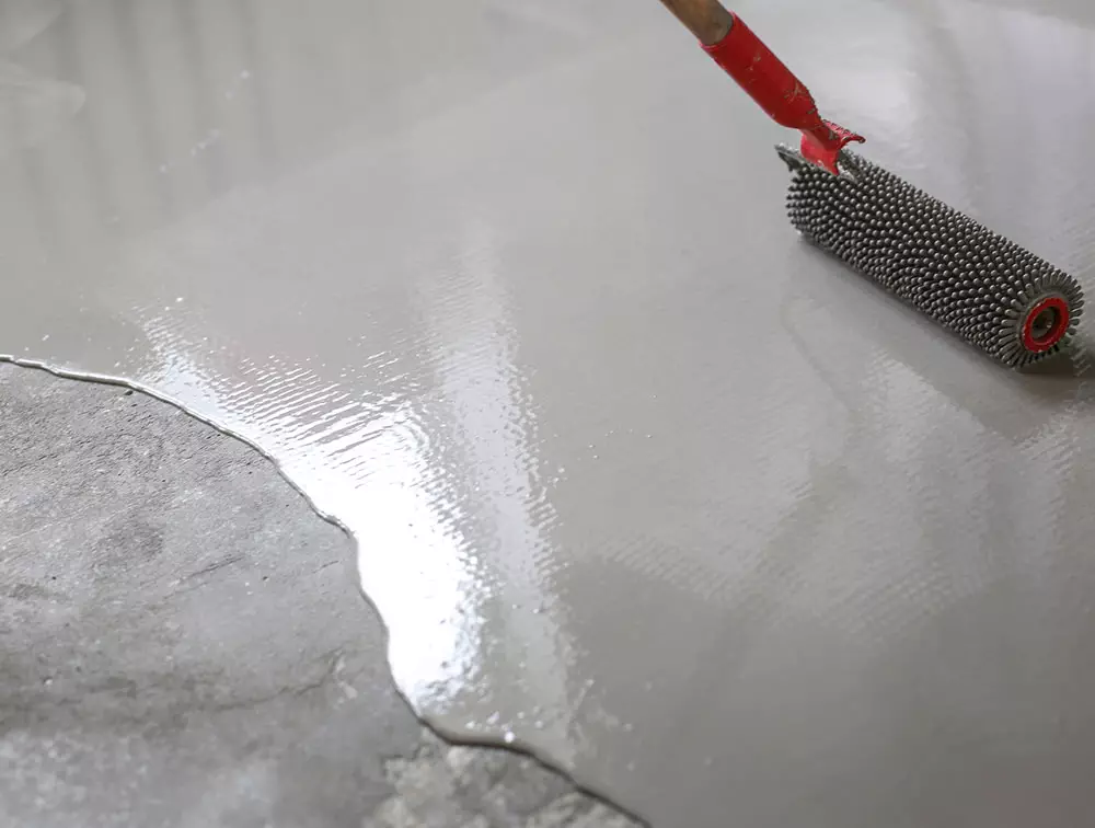 photo of self-leveling compound applied to a concrete floor in Edmonton