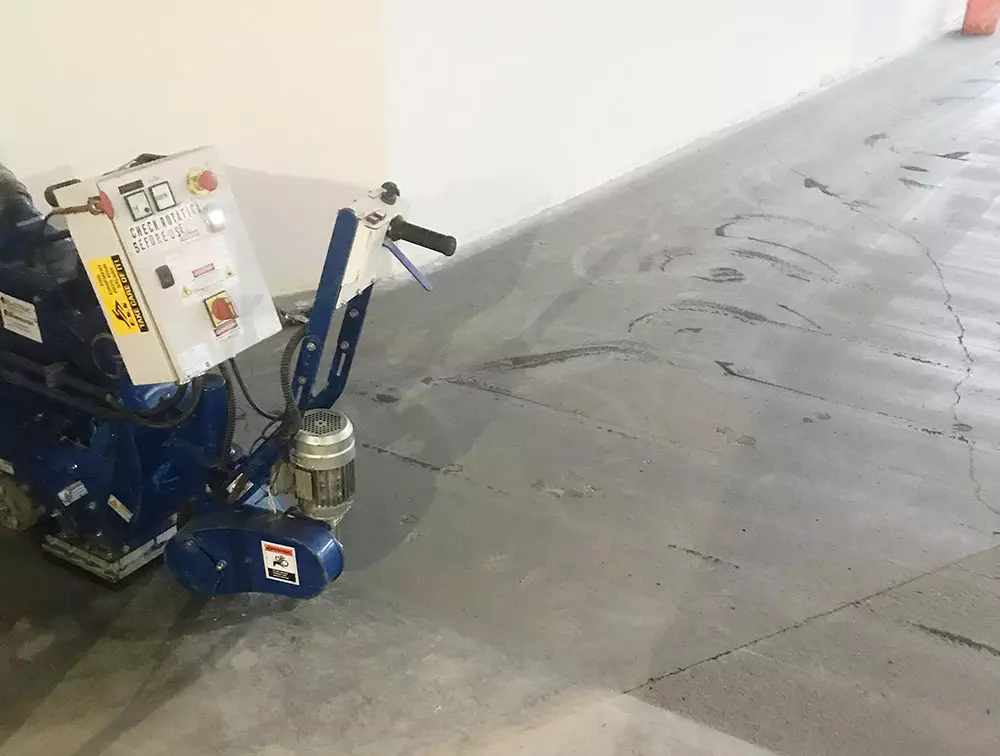 photo of a shot blasting machine used by ESS for removing old, rough surface prior to applying a new concrete epoxy surface